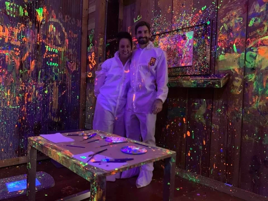 Couple in white suits for smash room